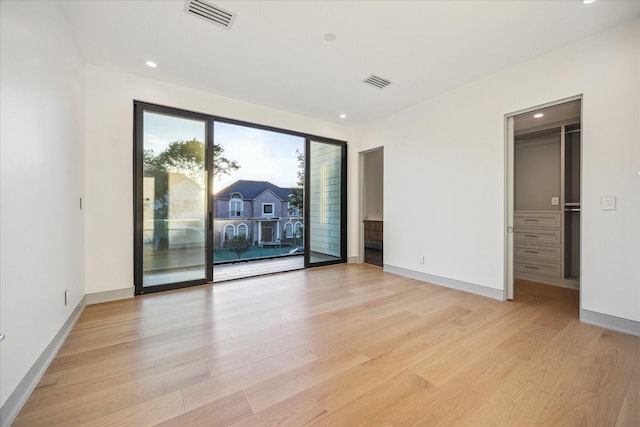 310 E Cowan Dr, Houston, TX 77007 - spare room with visible vents, light wood-style flooring, recessed lighting, and baseboards