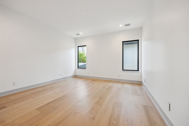 310 E Cowan Dr, Houston, TX 77007 - unfurnished room with baseboards, light wood-style flooring, visible vents, and recessed lighting