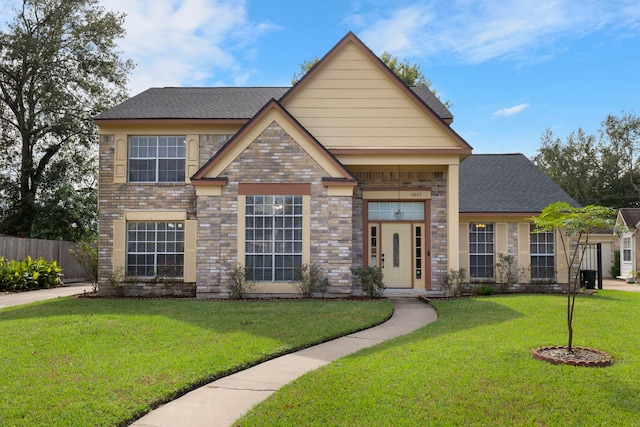 10223 Dude Rd, Houston, TX 77064 - craftsman-style home featuring a shingled roof, a front yard, fence, and brick siding