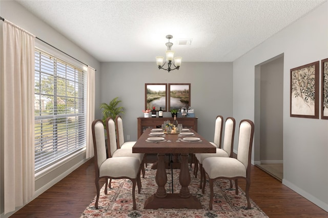 10223 Dude Rd, Houston, TX 77064 - dining room featuring a textured ceiling, wood finished floors, visible vents, and plenty of natural light