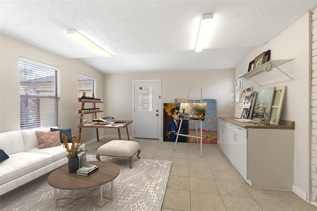10223 Dude Rd, Houston, TX 77064 - living room featuring light tile patterned floors and a textured ceiling