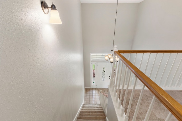 10223 Dude Rd, Houston, TX 77064 - stairs featuring a towering ceiling and carpet floors