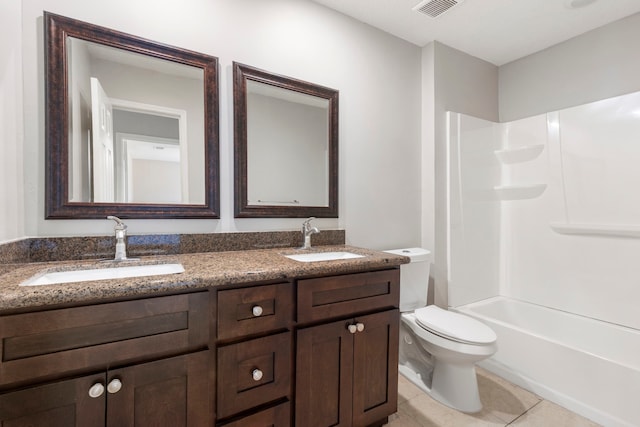 10223 Dude Rd, Houston, TX 77064 - bathroom with toilet, double vanity, a sink, and tile patterned flooring