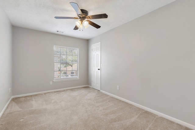 10223 Dude Rd, Houston, TX 77064 - empty room with visible vents, ceiling fan, light carpet, and baseboards