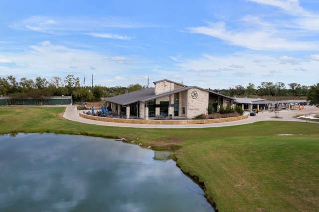 10223 Dude Rd, Houston, TX 77064 - exterior space with a front yard, stone siding, and a water view