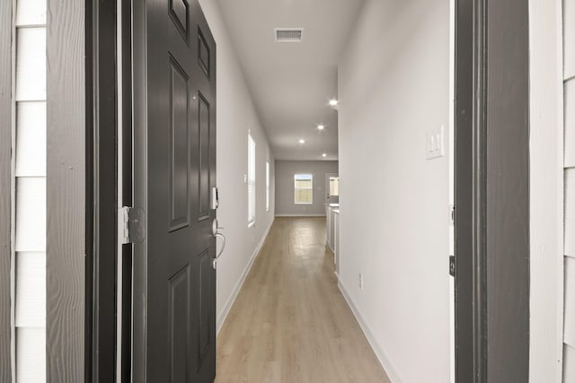 17836 Lionheart Rd, Conroe, TX 77306 - hallway with light wood-style flooring, baseboards, and recessed lighting
