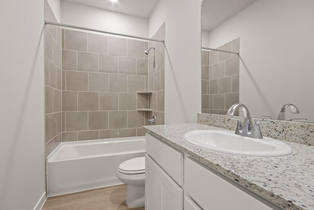 17836 Lionheart Rd, Conroe, TX 77306 - bathroom with toilet, vanity, shower / bathtub combination, and wood finished floors