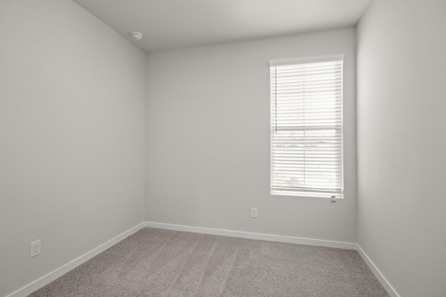 17836 Lionheart Rd, Conroe, TX 77306 - empty room featuring carpet floors, a smoke detector, and baseboards