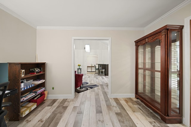 corridor featuring crown molding, baseboards, and wood finished floors