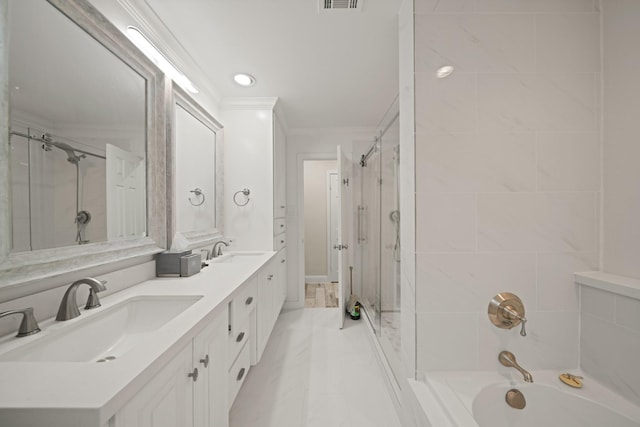 bathroom featuring crown molding, a sink, visible vents, and double vanity
