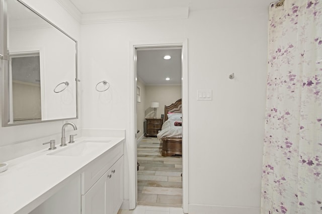 full bathroom featuring recessed lighting, ensuite bath, ornamental molding, and vanity