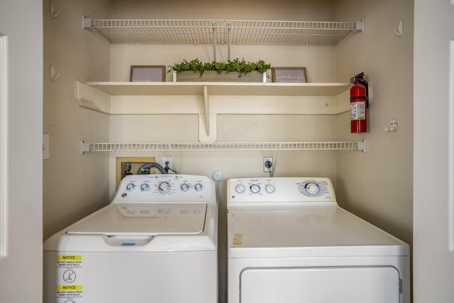 laundry room with independent washer and dryer and laundry area