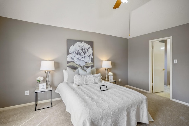 carpeted bedroom with baseboards, a ceiling fan, and lofted ceiling