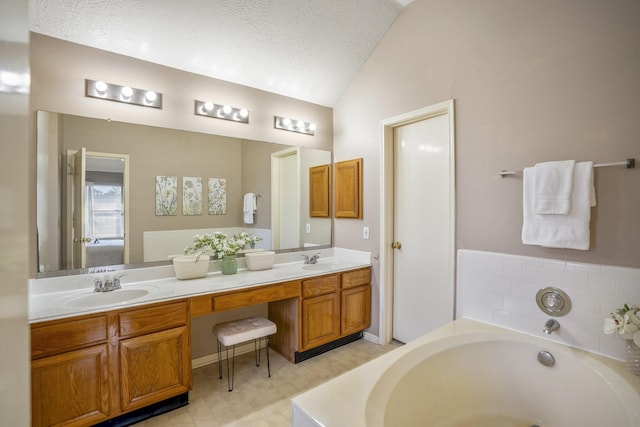 full bathroom featuring a sink, a bath, double vanity, and lofted ceiling