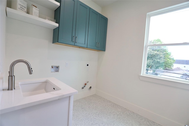 603 Neyland St, Houston, TX 77022 - washroom with washer hookup, cabinet space, hookup for an electric dryer, baseboards, and gas dryer hookup
