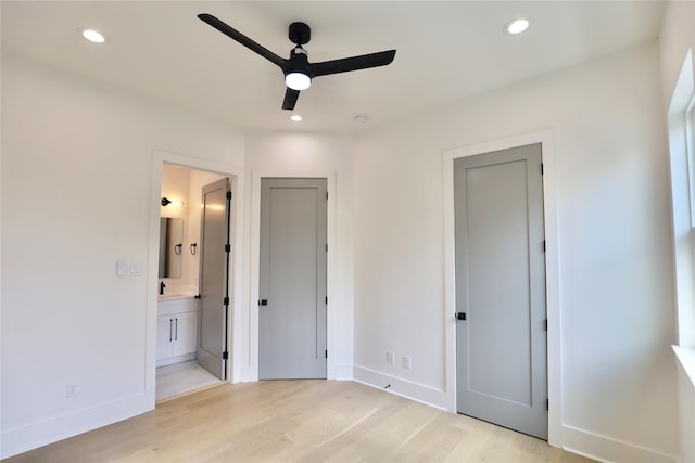 603 Neyland St, Houston, TX 77022 - unfurnished bedroom featuring light wood-style flooring, baseboards, ensuite bath, recessed lighting, and a sink