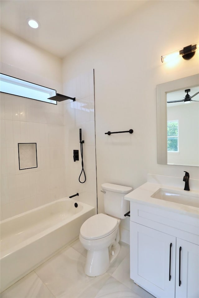 603 Neyland St, Houston, TX 77022 - bathroom with vanity, toilet, shower / tub combination, and a ceiling fan
