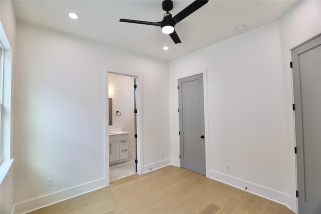 603 Neyland St, Houston, TX 77022 - unfurnished bedroom with light wood finished floors, recessed lighting, connected bathroom, baseboards, and a ceiling fan