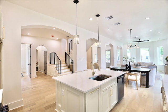 603 Neyland St, Houston, TX 77022 - kitchen featuring a sink, open floor plan, dishwashing machine, light wood-style flooring, and recessed lighting