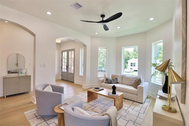 603 Neyland St, Houston, TX 77022 - living area featuring arched walkways, ceiling fan, light wood-type flooring, recessed lighting, and baseboards