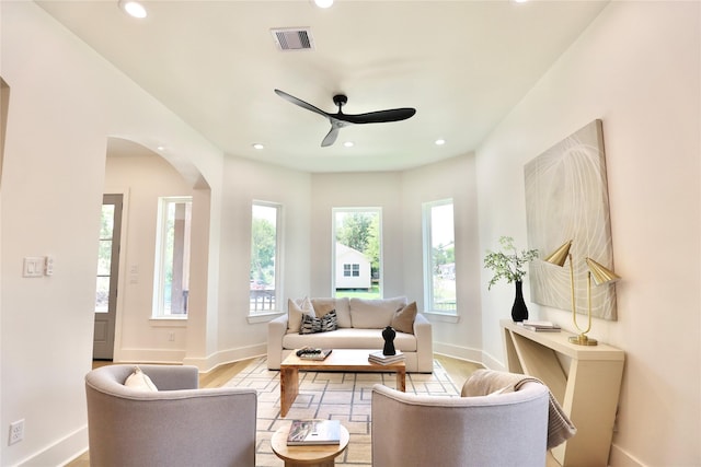 603 Neyland St, Houston, TX 77022 - living area featuring a ceiling fan, arched walkways, baseboards, recessed lighting, and wood finished floors