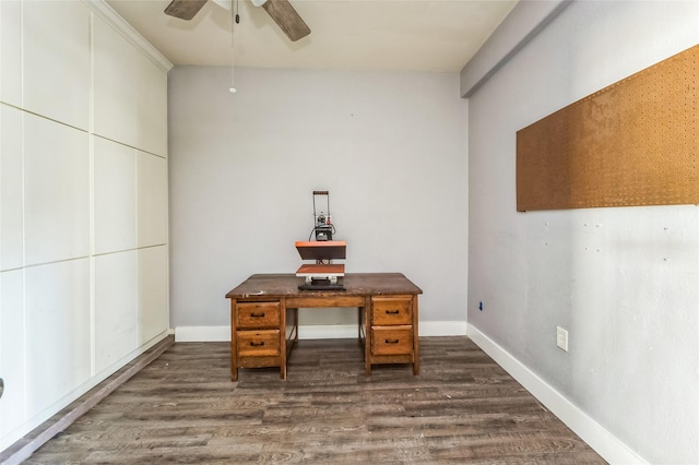 unfurnished office featuring ceiling fan, baseboards, and dark wood finished floors