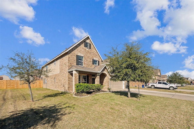 view of front of property featuring a garage, fence, brick siding, a front lawn, and driveway