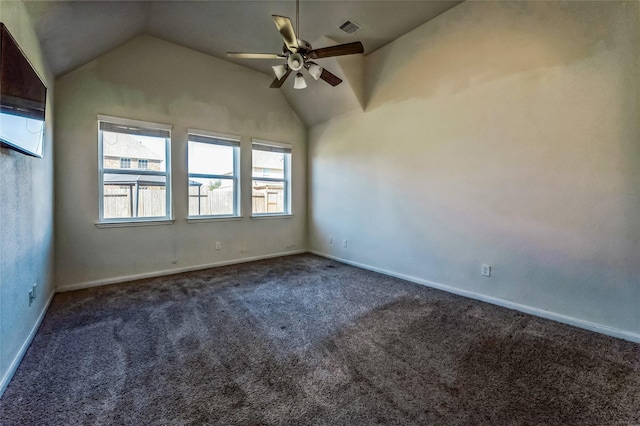 carpeted empty room with ceiling fan, baseboards, vaulted ceiling, and visible vents
