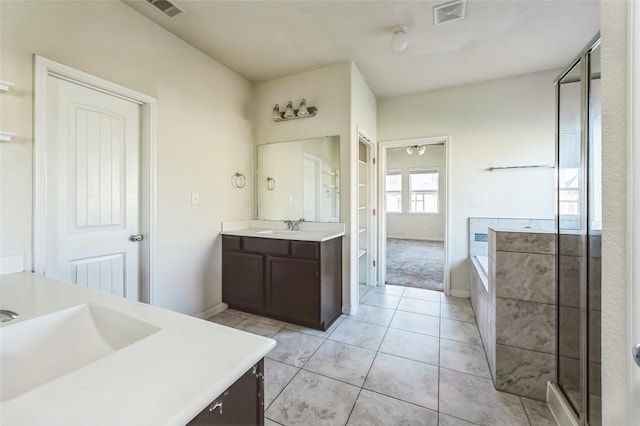 full bathroom featuring a sink, visible vents, and two vanities