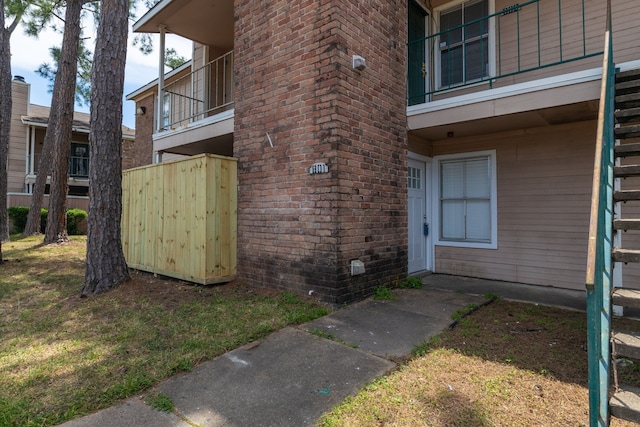 property entrance with brick siding