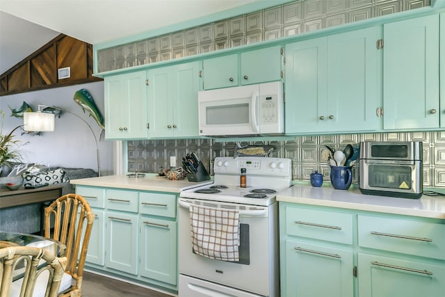 kitchen featuring tasteful backsplash, white appliances, and light countertops