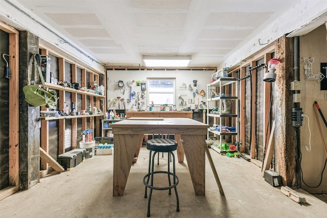 misc room featuring concrete floors and a workshop area