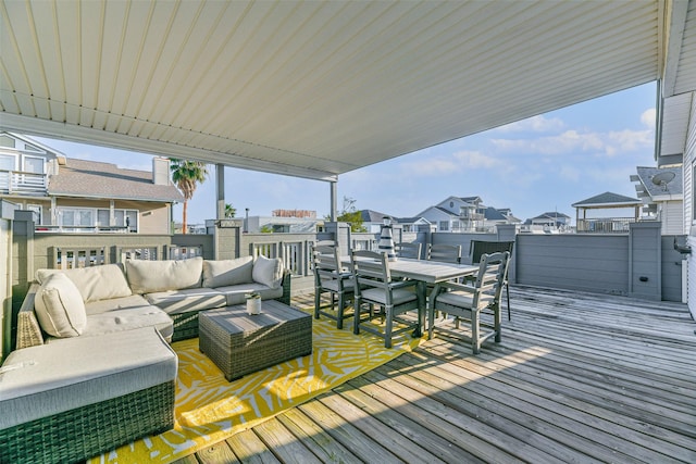 wooden deck with outdoor lounge area, a residential view, and outdoor dining area