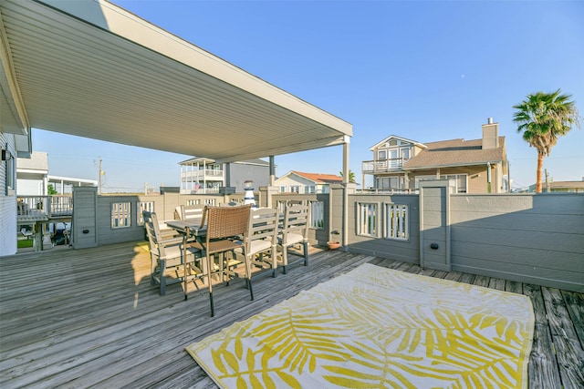 deck with outdoor dining area