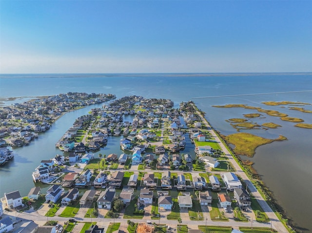 birds eye view of property with a water view and a residential view