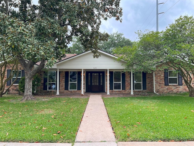 5475 Jackwood St, Houston, TX 77096 - single story home featuring a front lawn, brick siding, and covered porch