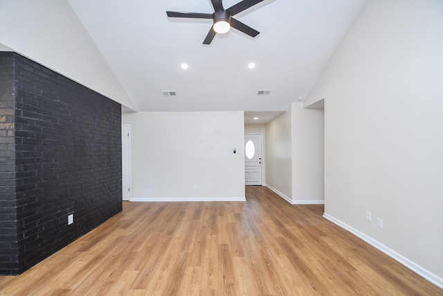19919 Burle Oak Dr, Humble, TX 77346 - unfurnished living room featuring light wood-style floors, ceiling fan, visible vents, lofted ceiling, and baseboards