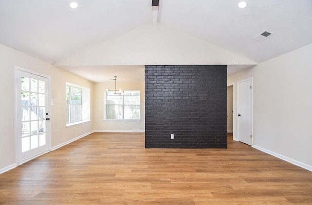 19919 Burle Oak Dr, Humble, TX 77346 - spare room featuring visible vents, baseboards, lofted ceiling with beams, recessed lighting, and light wood-style flooring