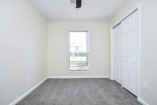 19919 Burle Oak Dr, Humble, TX 77346 - unfurnished bedroom featuring a closet, baseboards, and carpet