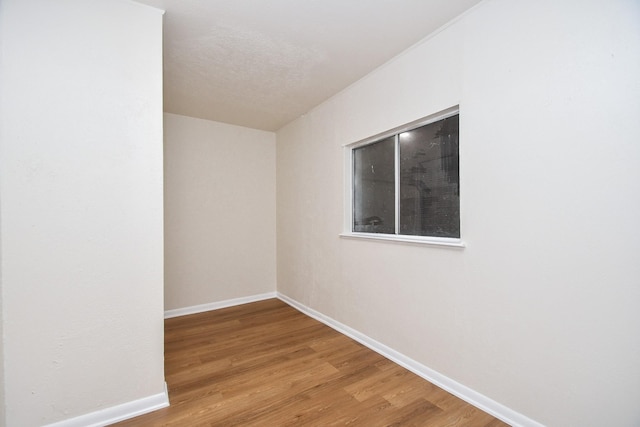 19919 Burle Oak Dr, Humble, TX 77346 - spare room featuring wood finished floors and baseboards