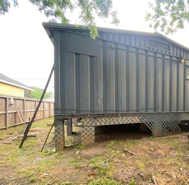 view of outdoor structure with fence