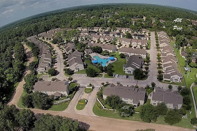 bird's eye view featuring a view of trees and a residential view