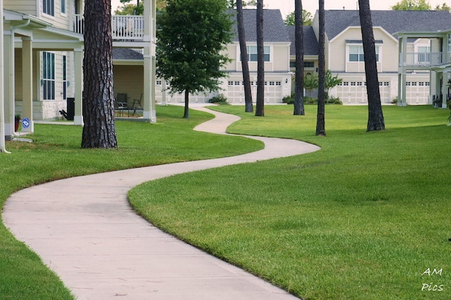 view of property's community with a yard