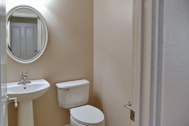 bathroom with a sink and toilet