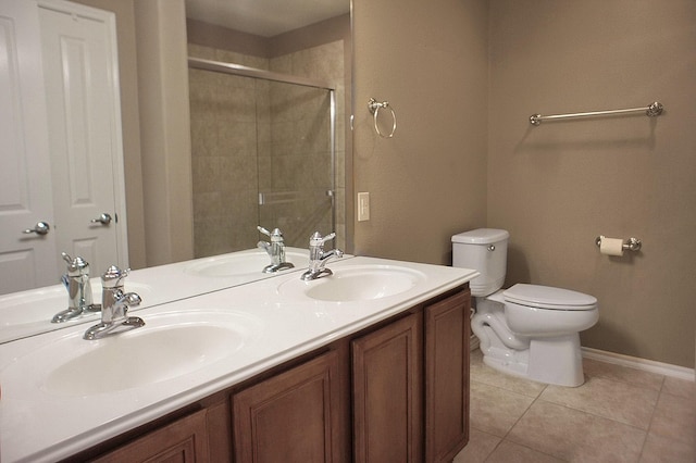bathroom with tile patterned flooring, a sink, and toilet