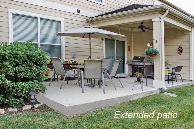 view of patio / terrace with outdoor dining space, a ceiling fan, and area for grilling