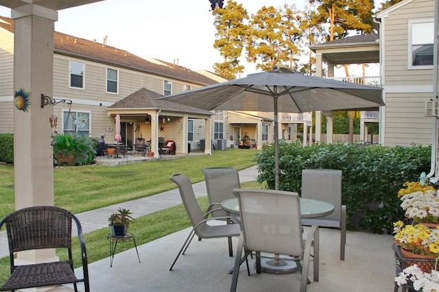 view of patio / terrace with central AC and outdoor dining space