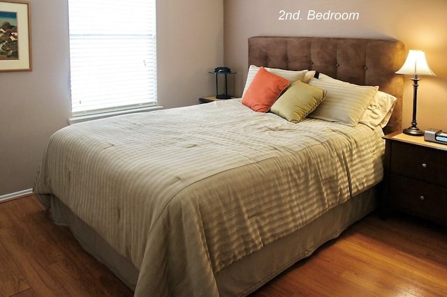 bedroom featuring wood finished floors