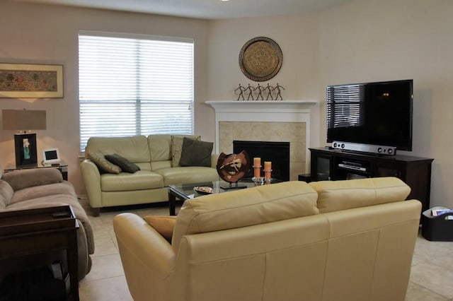 living area featuring a fireplace and light tile patterned flooring