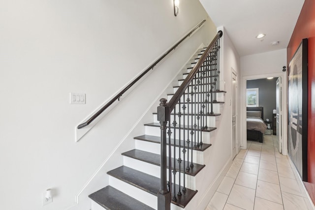 stairs with marble finish floor, baseboards, and recessed lighting